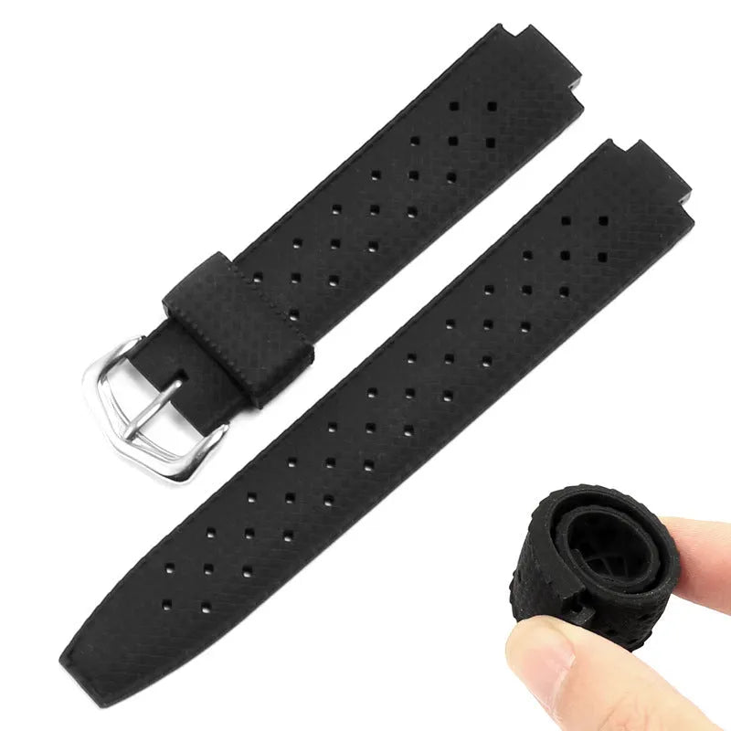 Black silicone watch strap with silver pin buckle and raised mouth design for blue dial watches