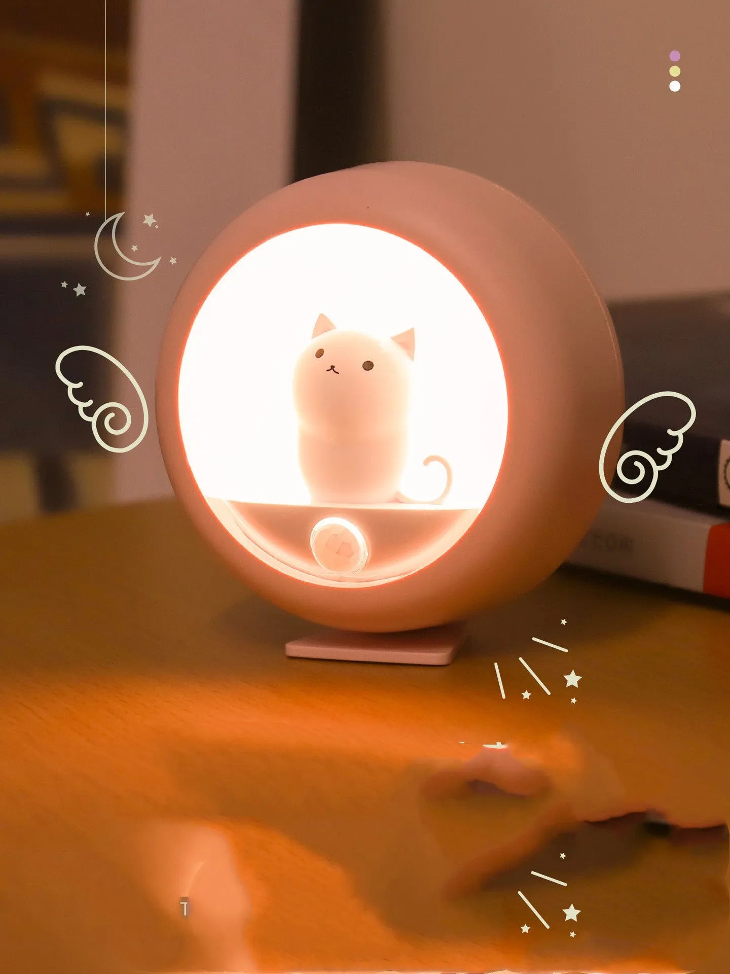 White sleep lamp with star projection and multicolour lighting options on bedside table