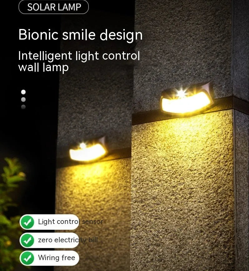 Solar-powered outdoor wall lamp with smiling face design for garden or courtyard lighting.