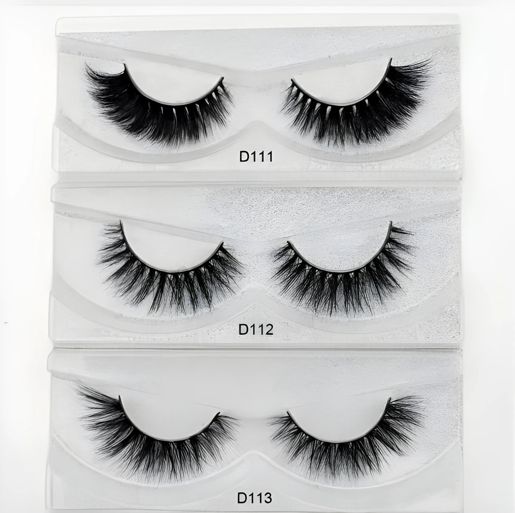 Pair of faux mink eyelashes with long tail and cotton stem against white background