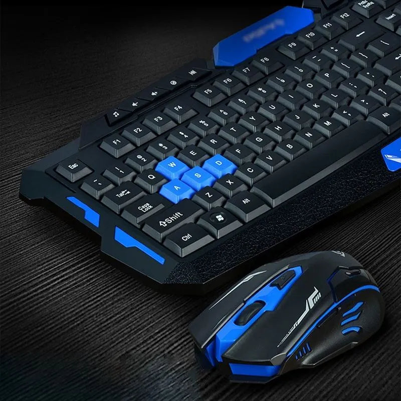 Black and blue wireless keyboard and mouse set with ergonomic design on a desk