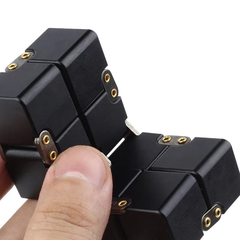Black zinc alloy infinity cube fidget toy showing eight connected cubes.