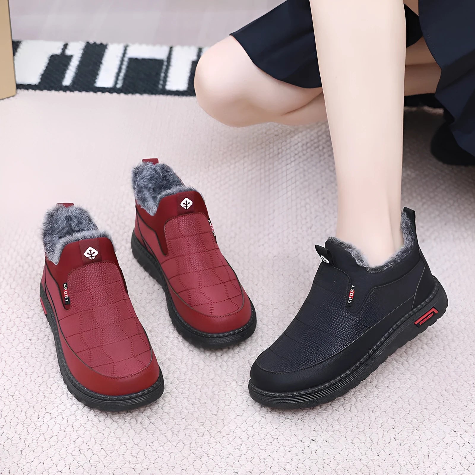 Women's black casual flat ankle boots with a round toe and non-slip rubber sole.