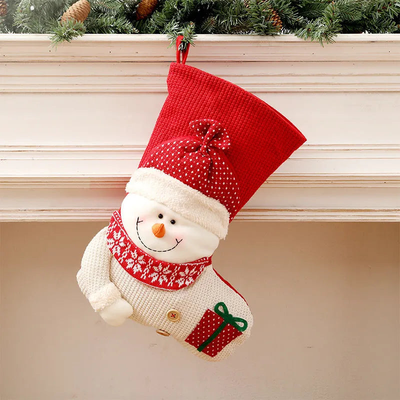 Large red and white knitted Christmas stocking with Santa Claus design for fireplace decor