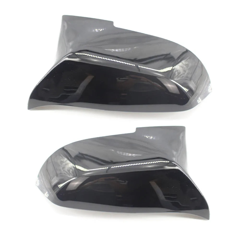 Pair of paint bright black BMW F-Series rear-view mirror replacement shells.
