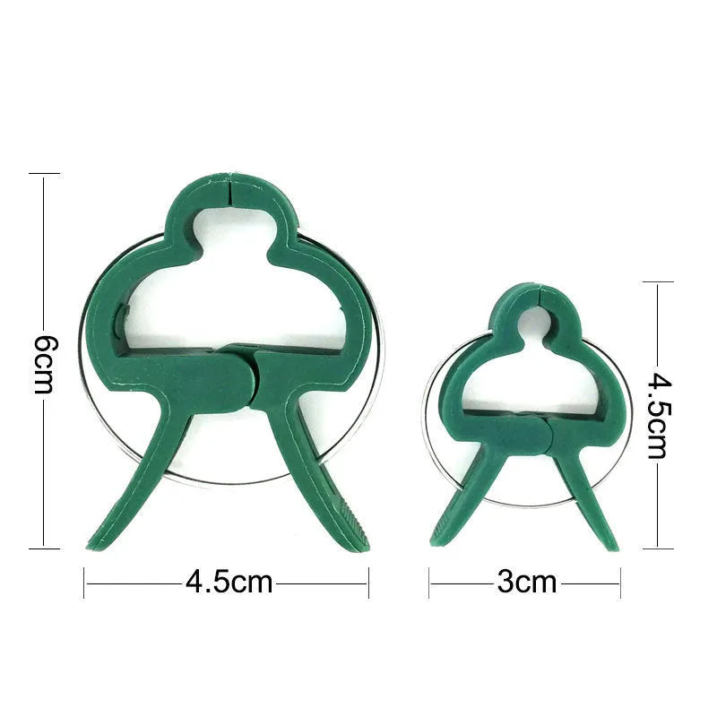 Green plastic and zinc plant fixing clips, showing large and small sizes for garden vine support.