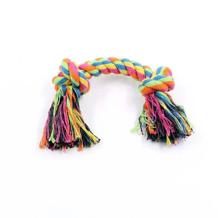 Double knot cotton rope dog toy on neutral background showing two rope knots and loose ends