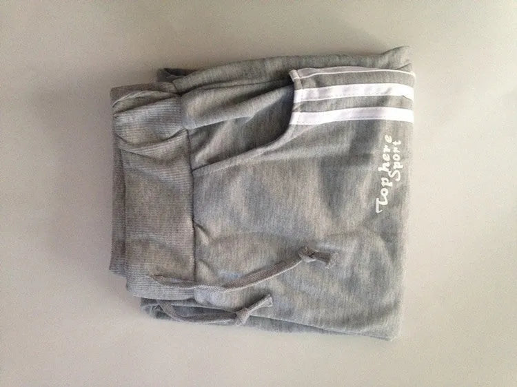 Men's straight leg cotton casual trousers with three-bar side stripe in grey, black, and navy