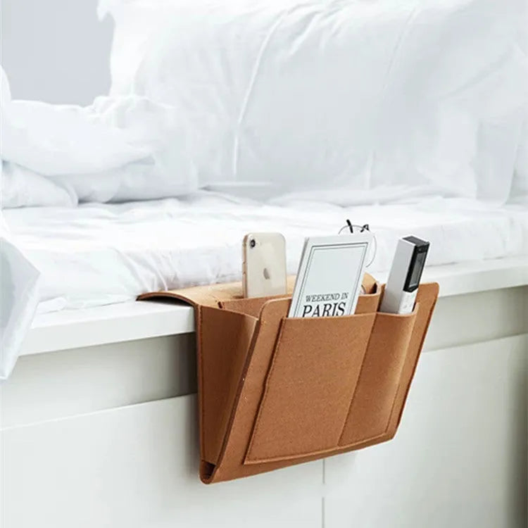 Felt bed storage bag with pocket in beige on a bed, small size 28x24cm, anti-slip organiser for mattress or sofa