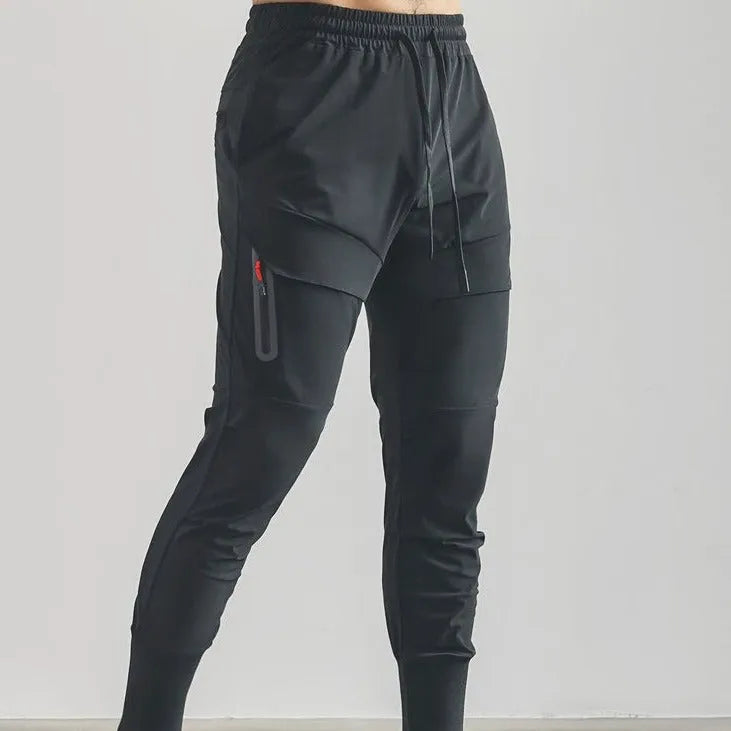 Men's solid colour polyester jogger pants in black, mid-waist style, casual sports trousers
