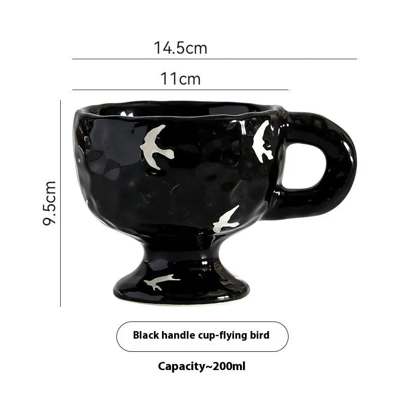 Hand-pinched irregular ceramic mug showing solid colour and unique shape