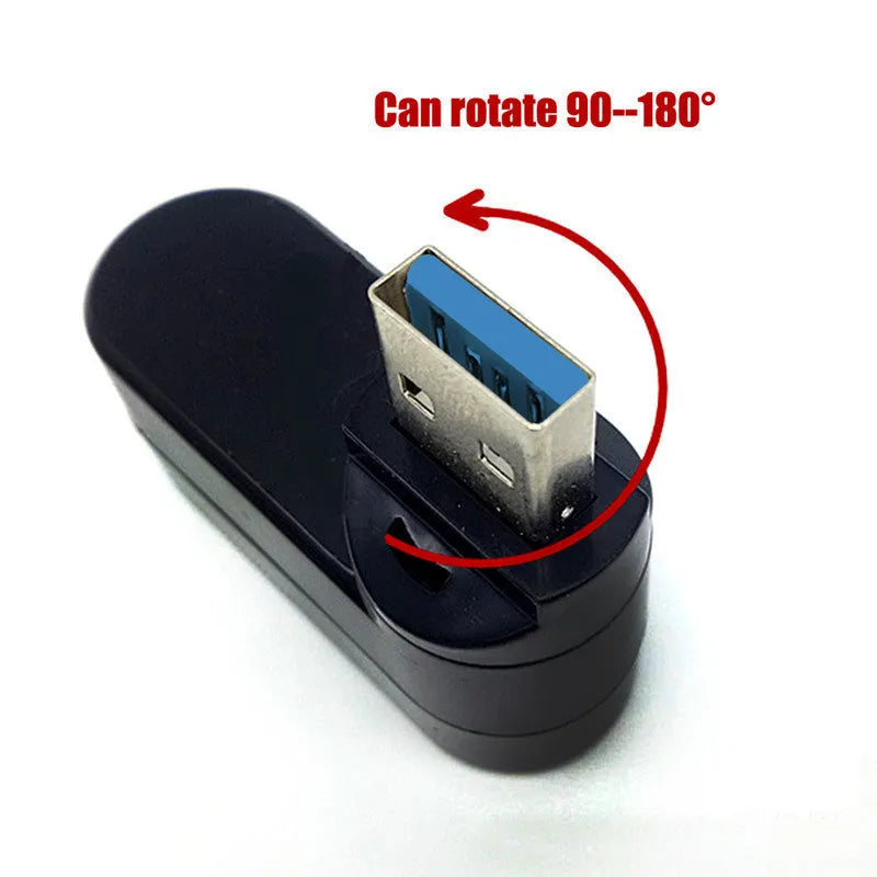Black USB rotary splitter hub with four USB ports on a white desktop