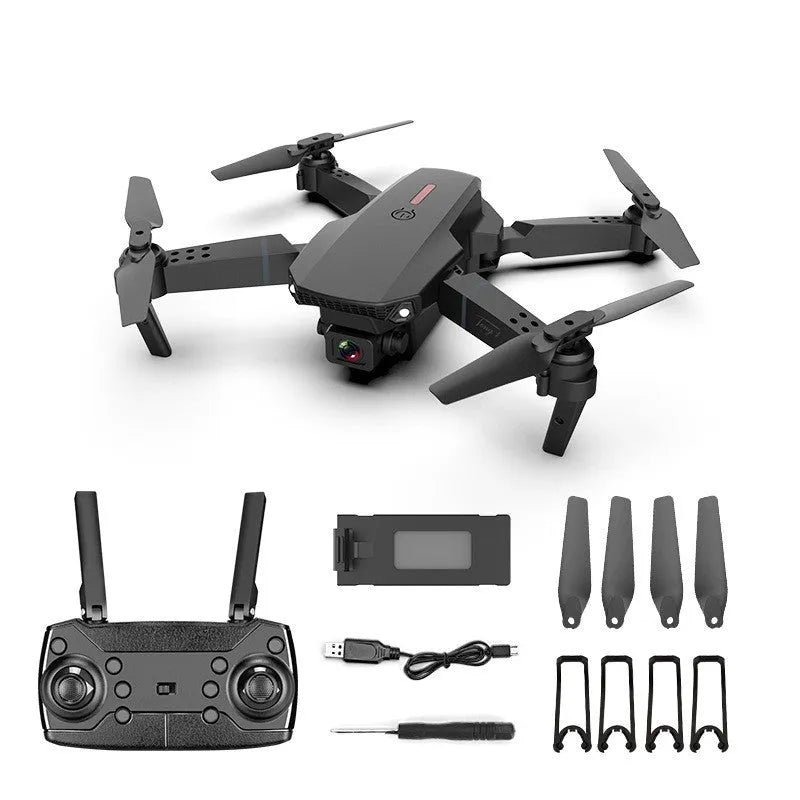 Grey foldable 4K dual camera aerial drone with remote control and spare blades