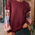 Women's plaid patterned long-sleeved casual top in apricot colour with striped design elements