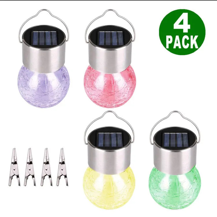 Outdoor solar glass ball chandelier with LED light in a garden setting, showing colourful lighting option