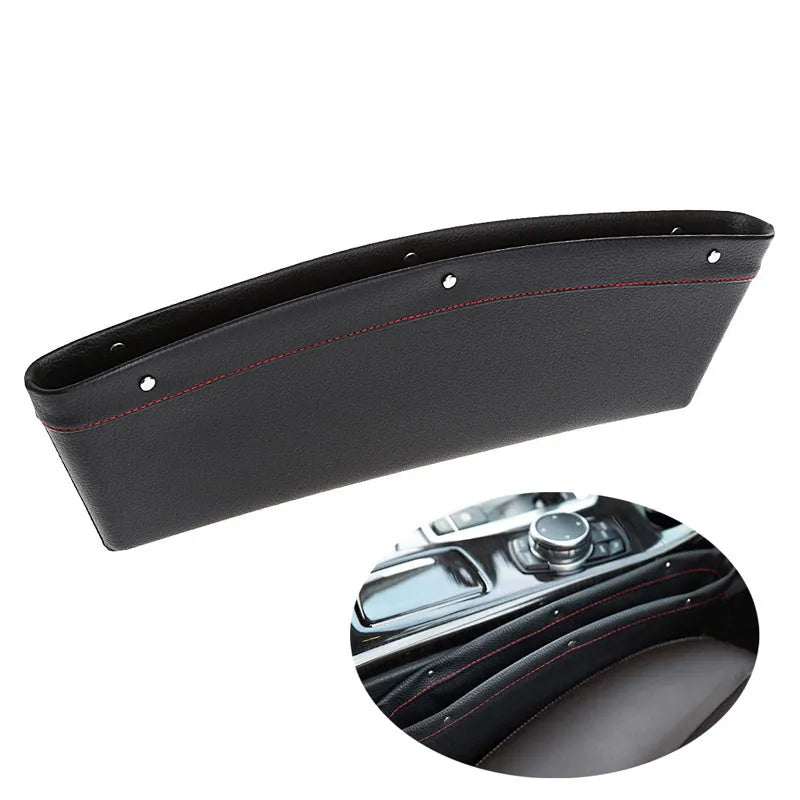 Faux leather car seat gap organiser in black holding phone, keys, and bills, fitted between car seat and centre console.