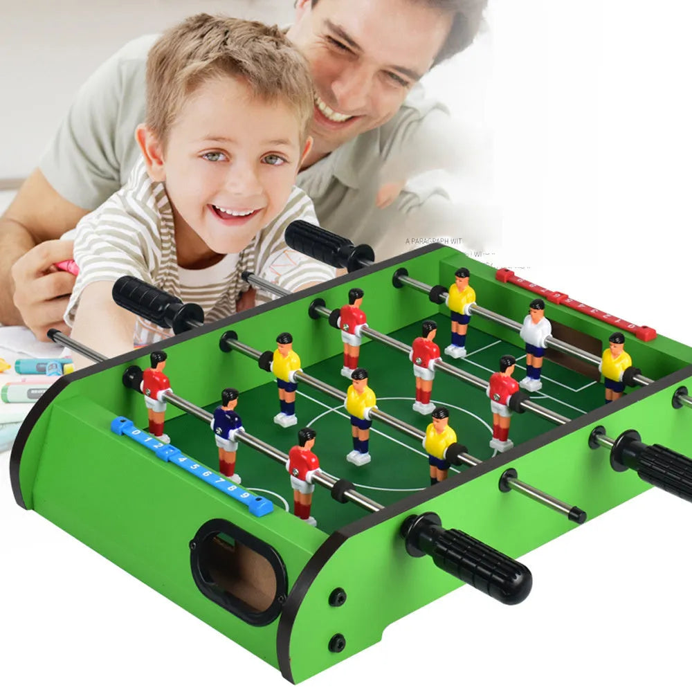 Wooden table football machine with two sets of coloured player figures on a green playing field, ready for two-person play