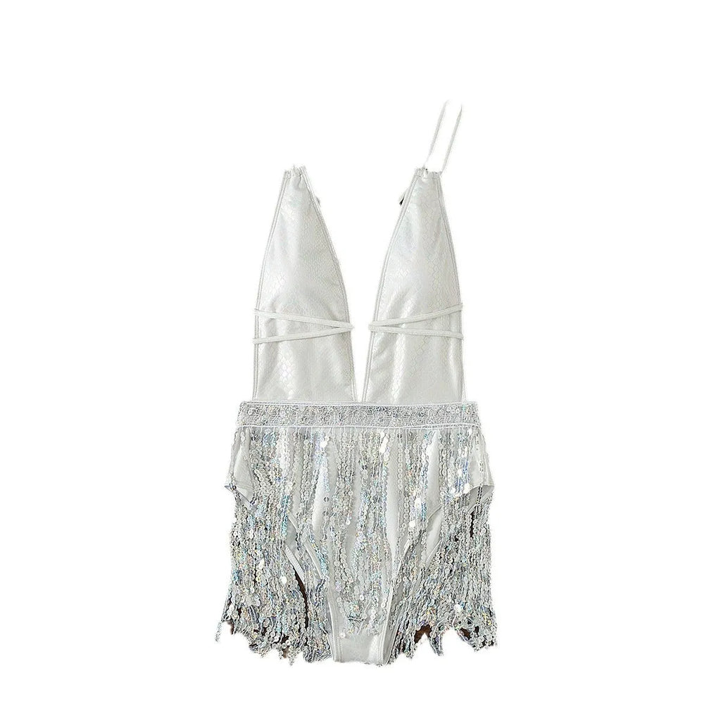 White one-piece swimsuit with deep V-neck and tassel detail on a mannequin