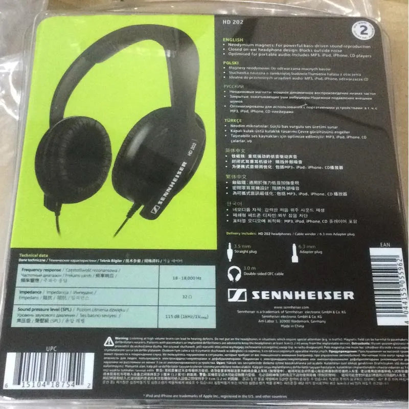 Black wired head-mounted monitor headphones with 40mm driver and 2.5m cable on a desk