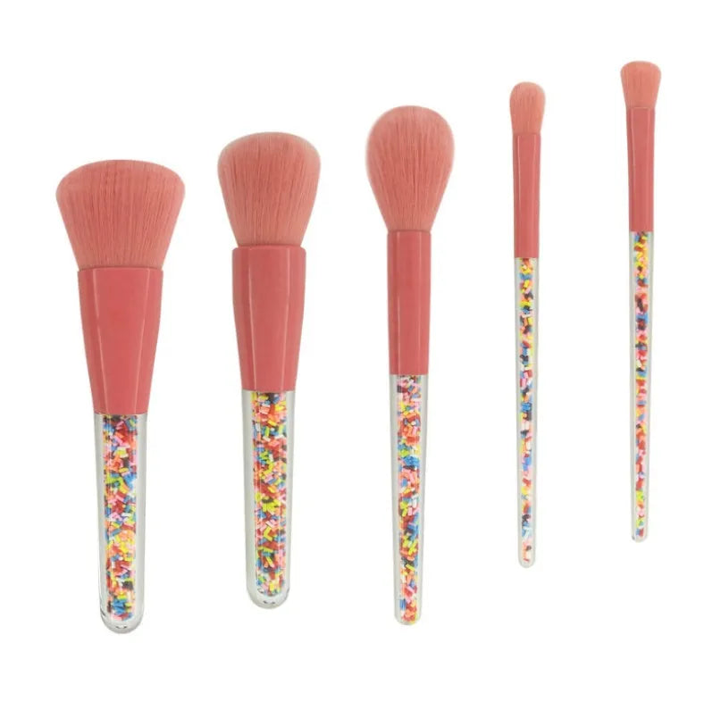 5 candy makeup brushes with colourful acrylic handles, fibre hair bristles, and aluminium ferrules on a white background