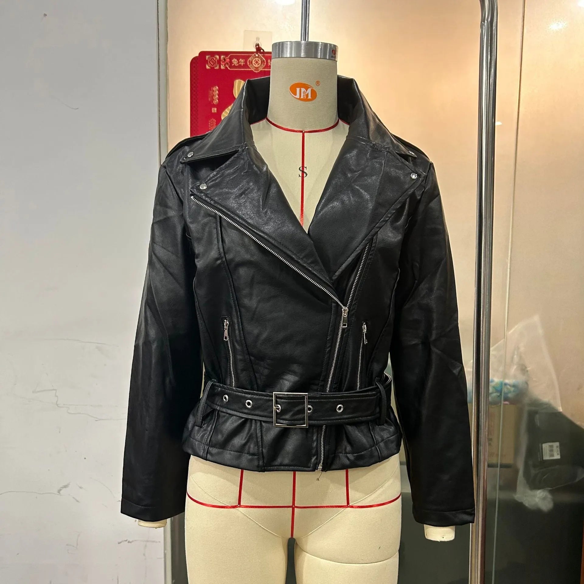 Punk style short belt lapel locomotive jacket in polyester leather, available in black, blue, and green.