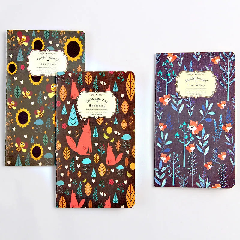 Hand-stitched kraft paper notebook with tassel bookmark on blank pages.