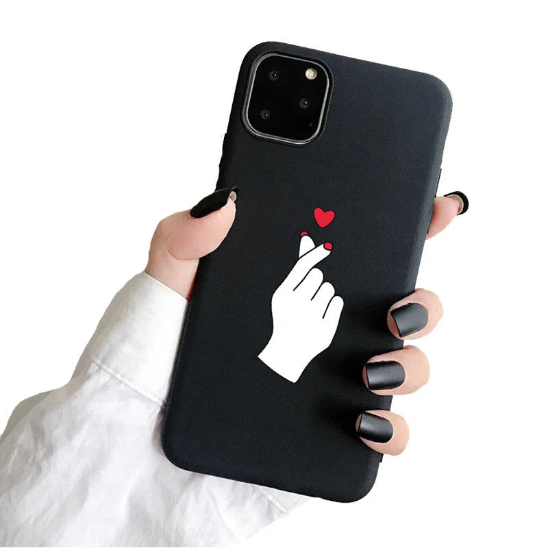 Frosted TPU iPhone case showing painted 'LOVE' letter design on a pink background.