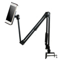 Black lazy mobile phone holder made of carbon steel and aluminium alloy placed on a bedside table.