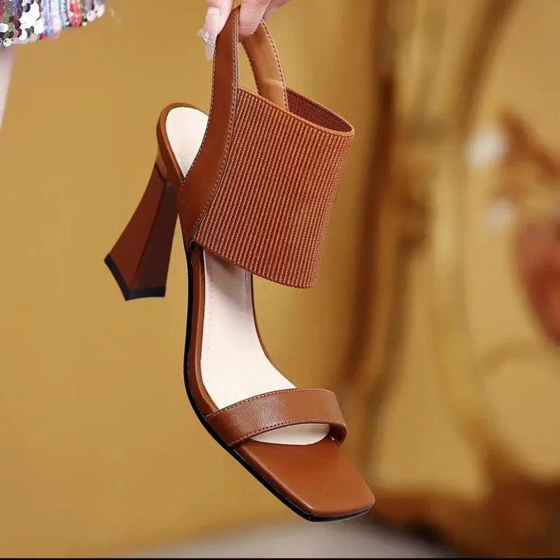 Women's black high heel sandals with elastic strap and rubber sole