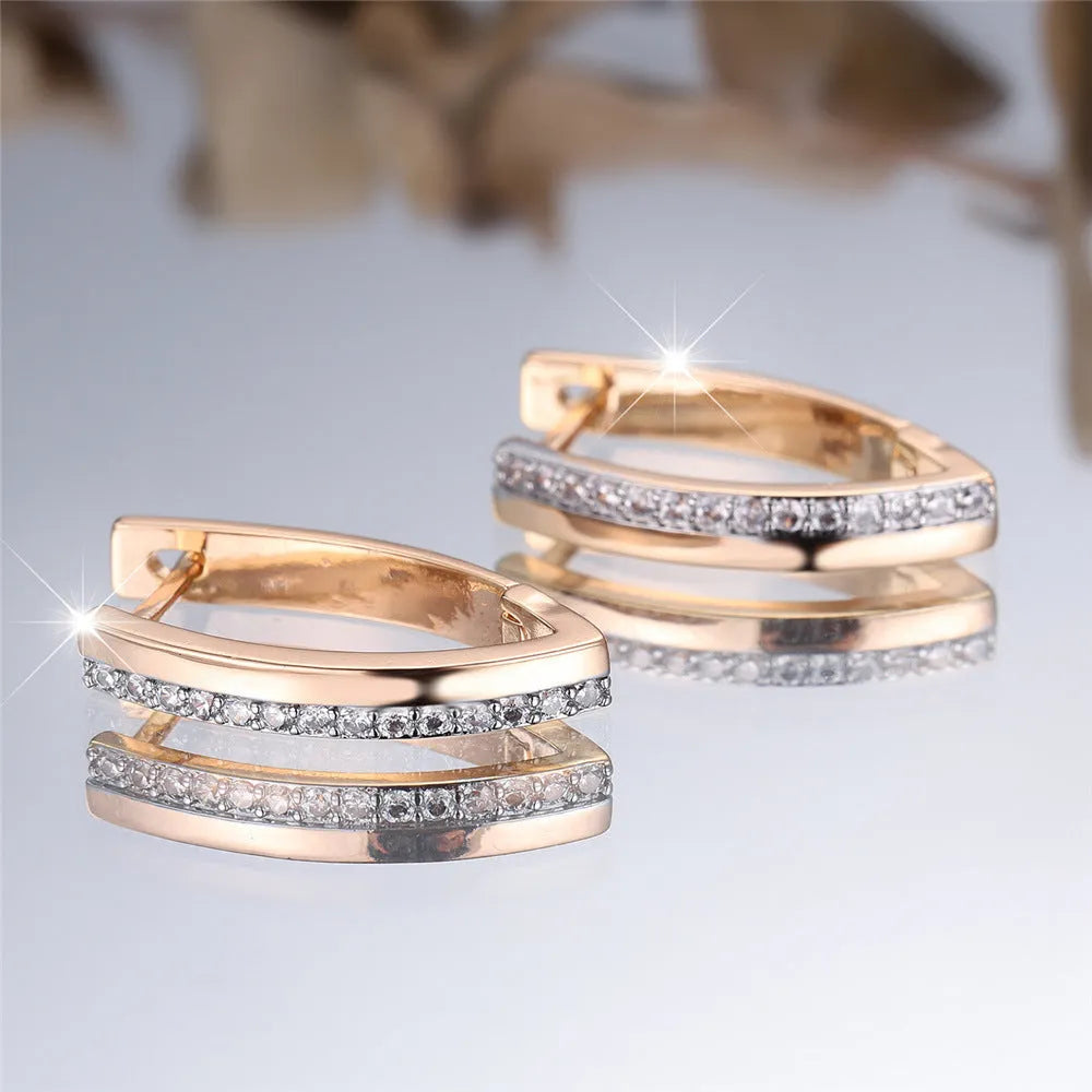Women's V-shaped electroplated copper ear clips in Champagne Gold and White Diamond geometric design