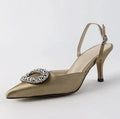 Red satin rhinestone high heel pump with pointed toe and buckle strap on stiletto heel