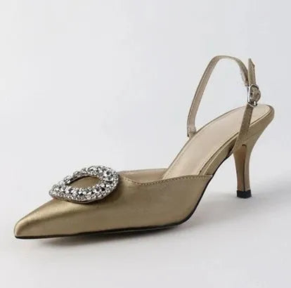 Red satin rhinestone high heel pump with pointed toe and buckle strap on stiletto heel