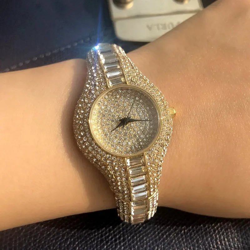 Women's gold alloy quartz watch with round dial showing diamond and colourful stone inlays