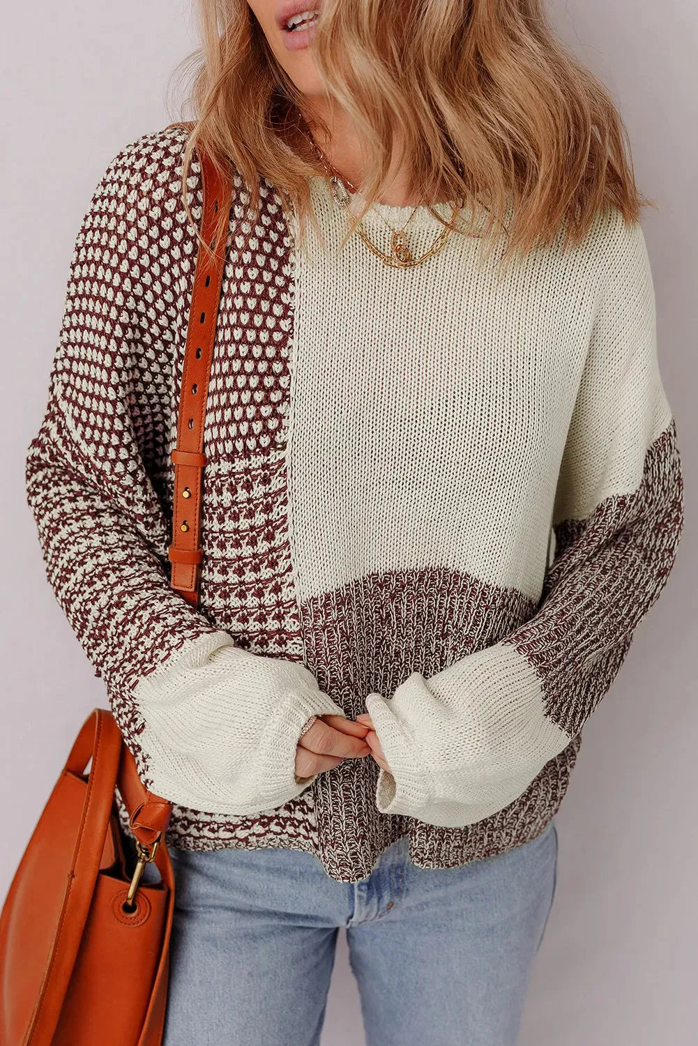 Dark khaki loose fit sweater showing back tie detail on colour block panel.