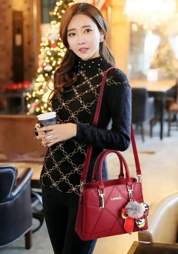 Ladies PU messenger bag with embroidery detail and soft handle in cross-section square shape