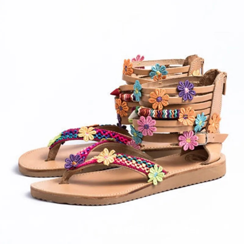 Beige ethnic Roman sandals with flat sole, round toe, and decorative beaded petals.