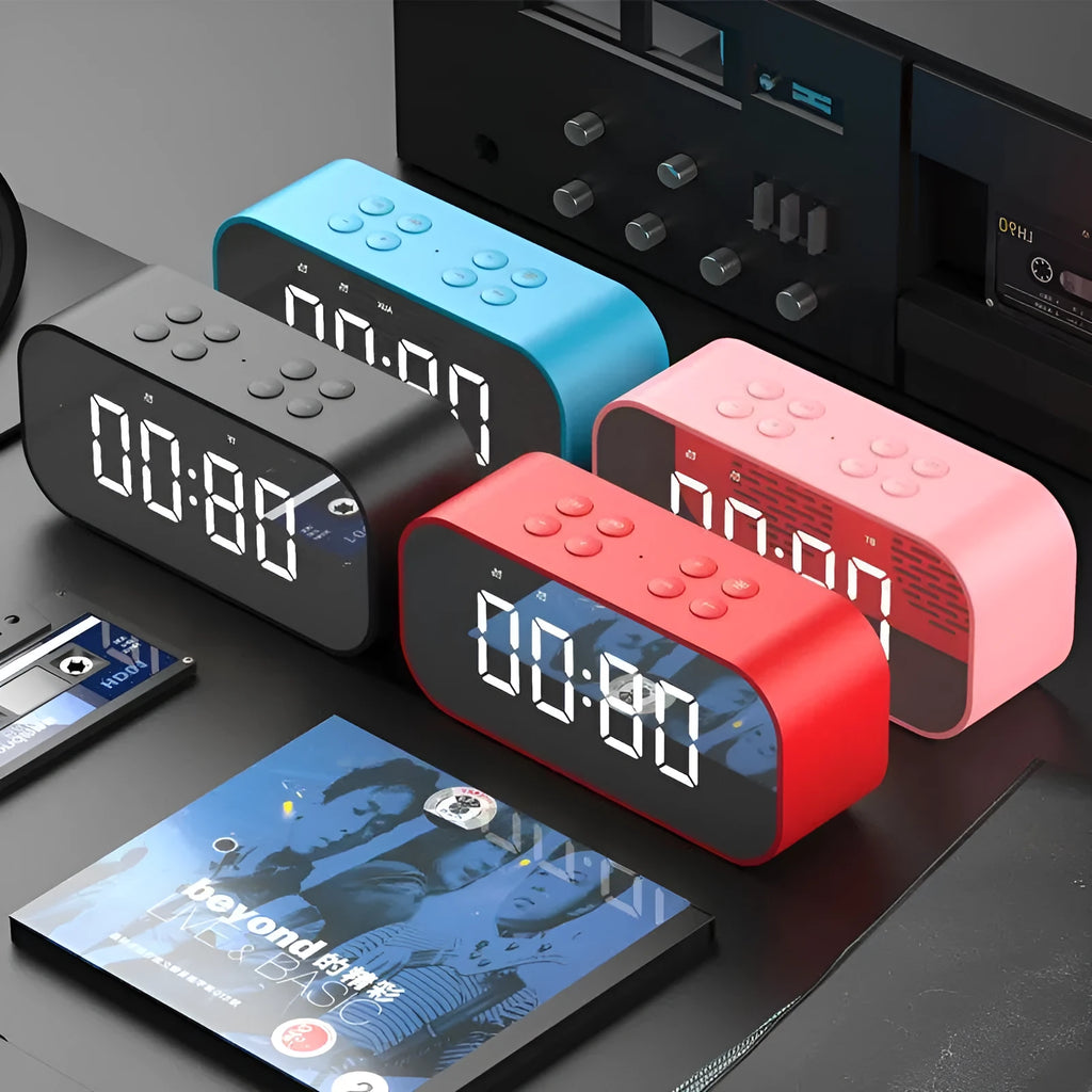 Wireless Bluetooth speaker with LED clock display showing time, black colour, compact ABS body on a desk