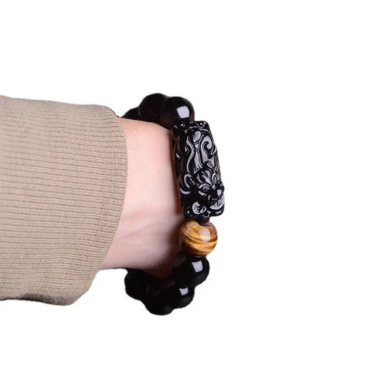 Natural obsidian Pi Xiu bracelet with carved charm, 12mm beads, on a gift box