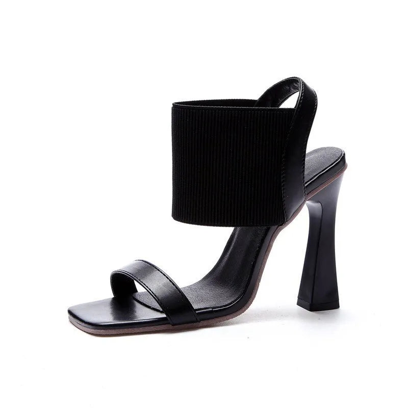 Women's black high heel sandals with elastic strap and rubber sole