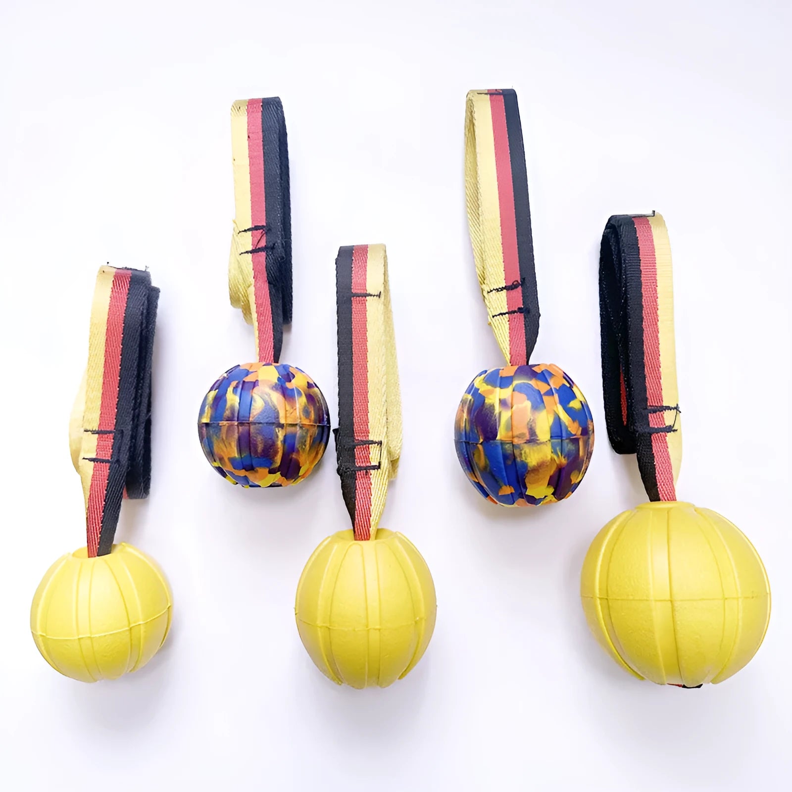 Floating EVA pet training ball in yellow and camouflage colours showing three diameter sizes for water fetch