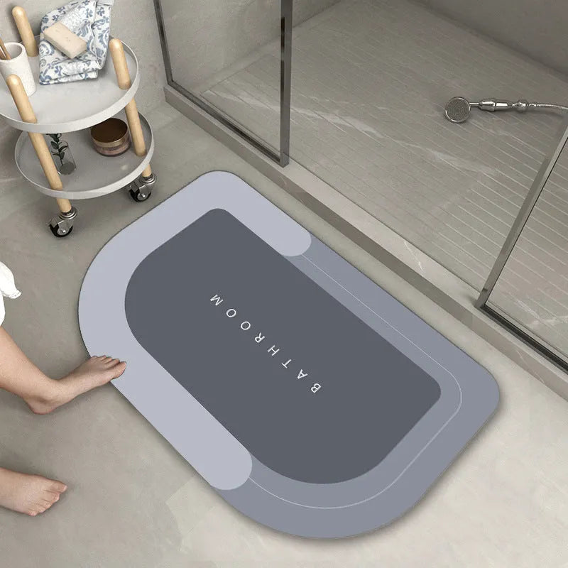 Blended fabric bathroom floor mat in blue, available in oval and rectangular shapes.
