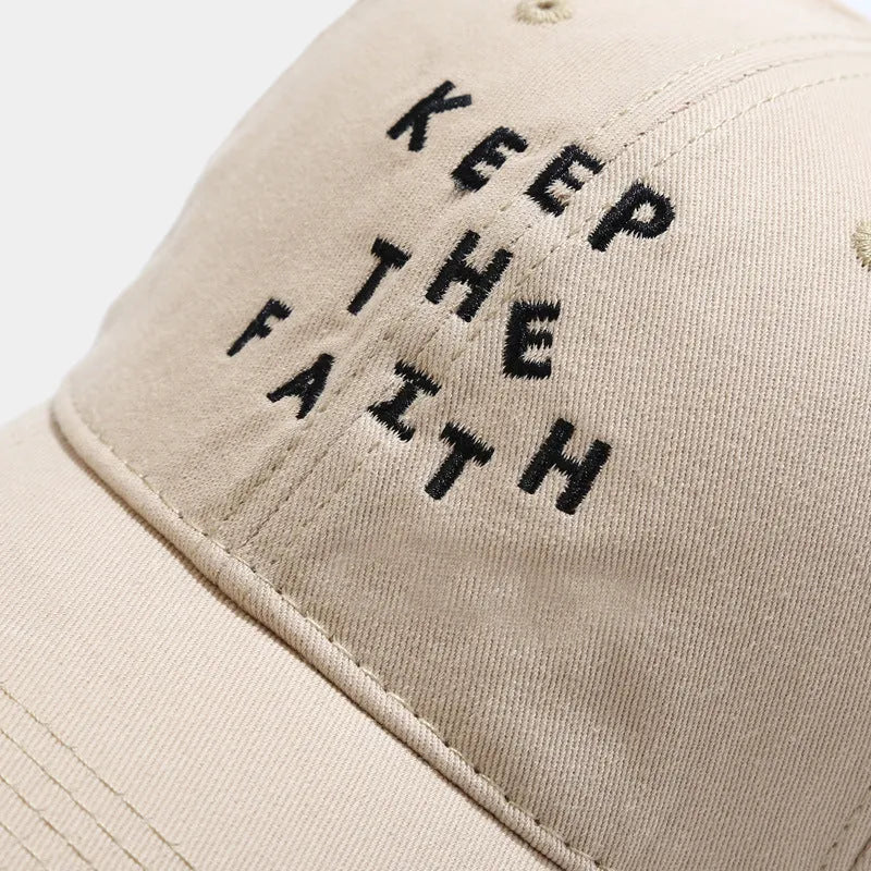 Men's beige cotton baseball cap with adjustable strap and dome crown on a white background.