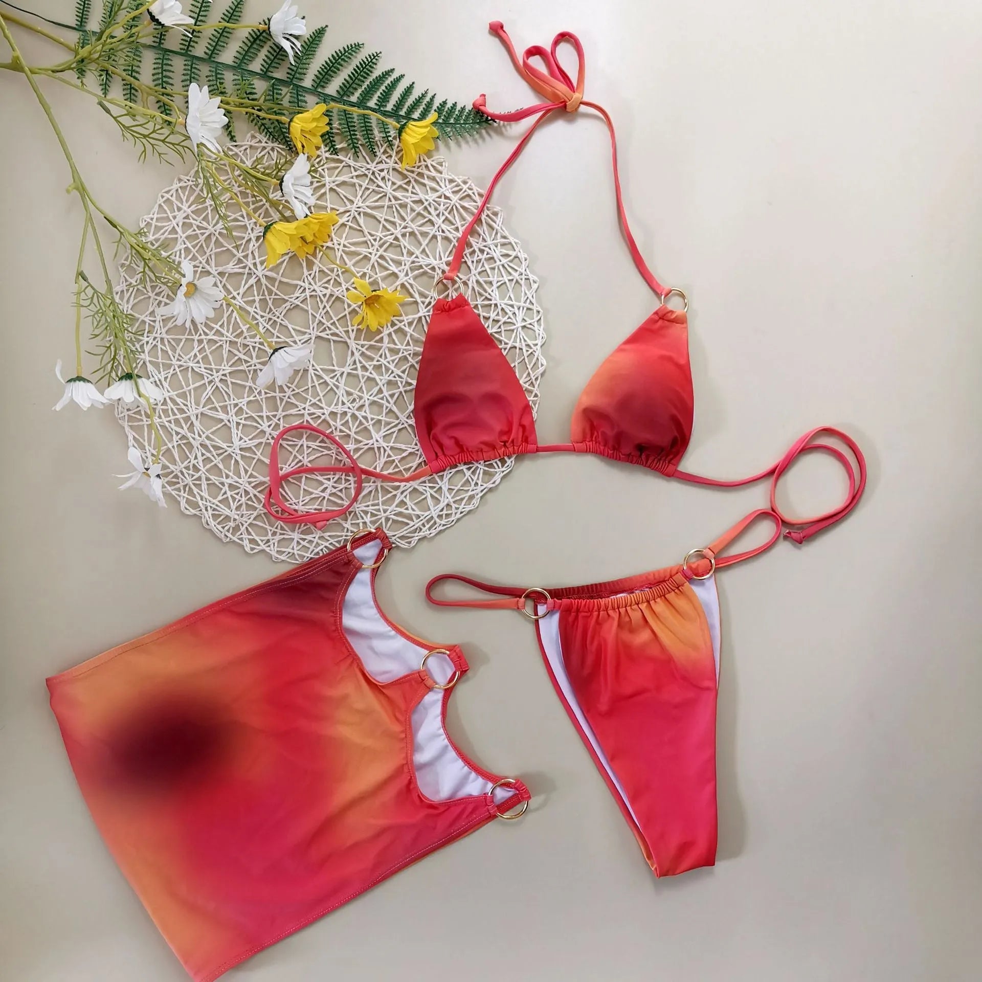 Tie-dye three-piece halter bikini swimwear set with top, pants, and skirt