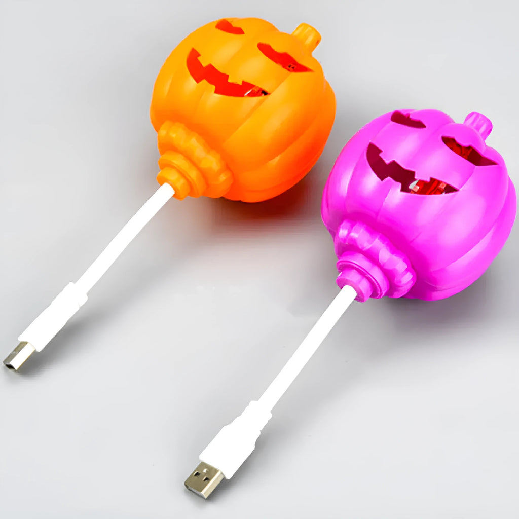 Plastic pumpkin-shaped lamp glowing with either purple or yellow light, measuring 22cm tall.