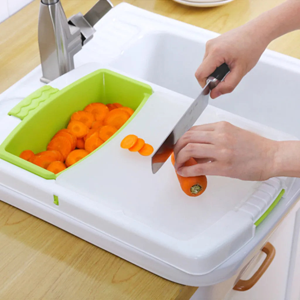 Green multi-function kitchen cutting board with integrated draining basket mounted on sink