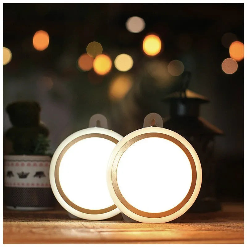 Compact round motion sensor LED light with 80mm diameter, shown in a wardrobe setting.