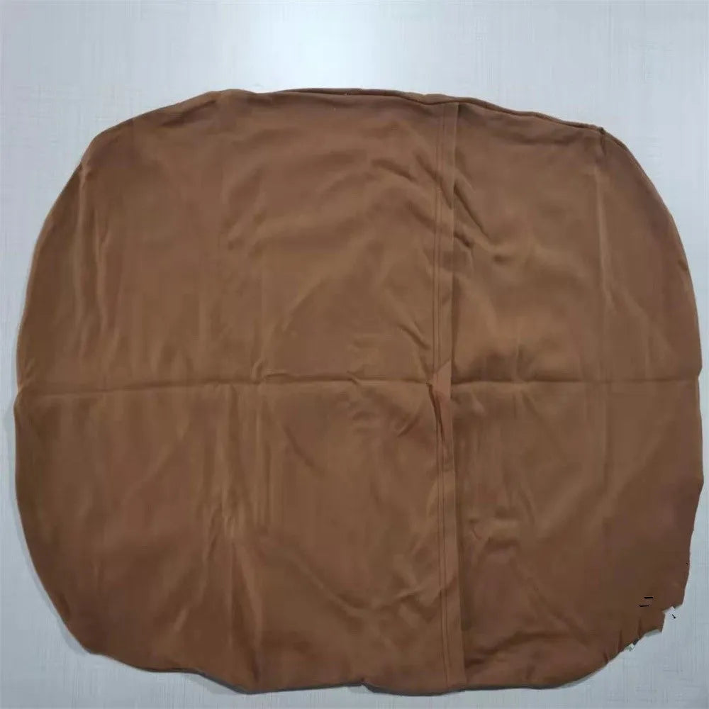 Cotton portable baby nest crib for newborns, beige colour, shown on a bed.
