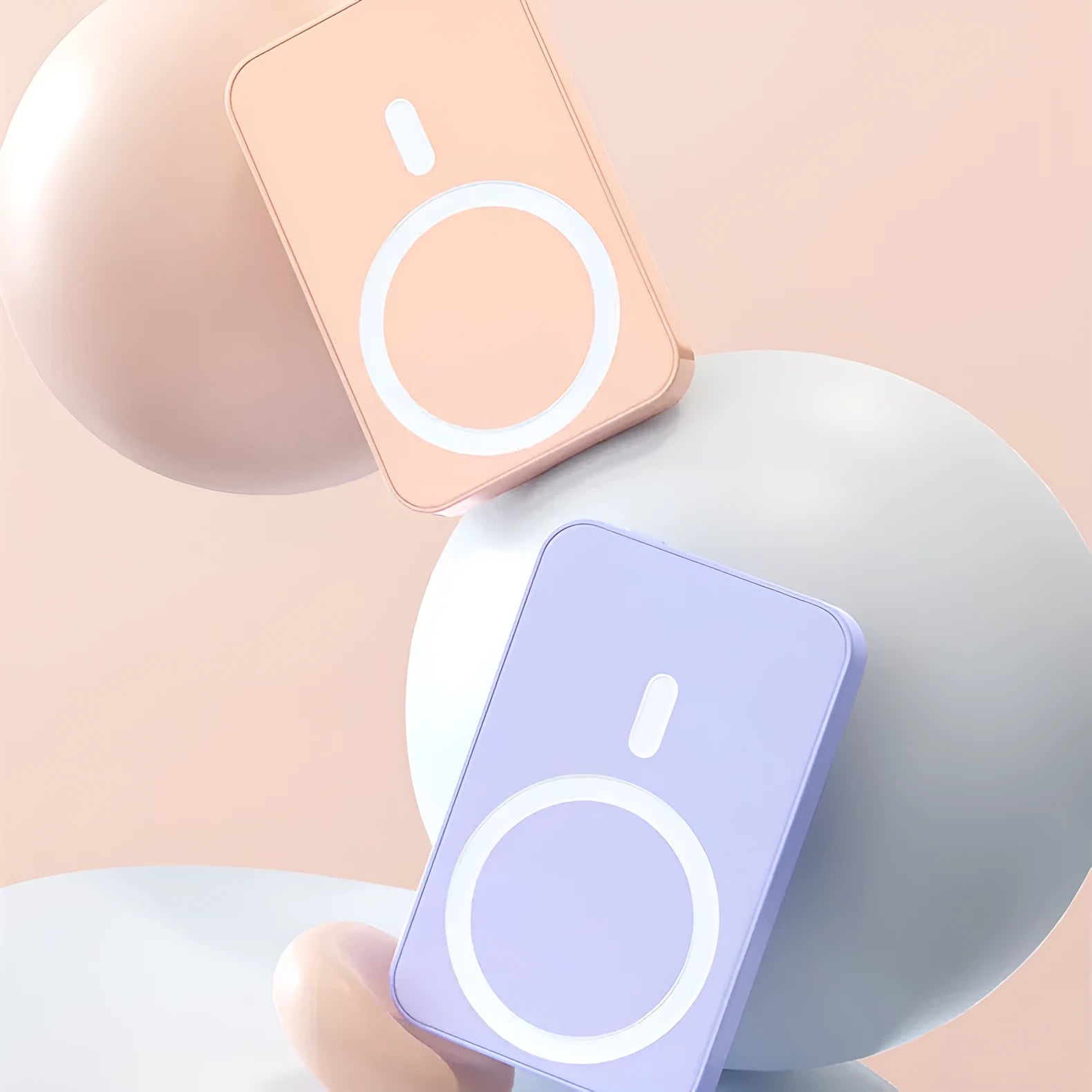 Pink magnetic wireless power bank showing dimensions of 100mm by 64mm.