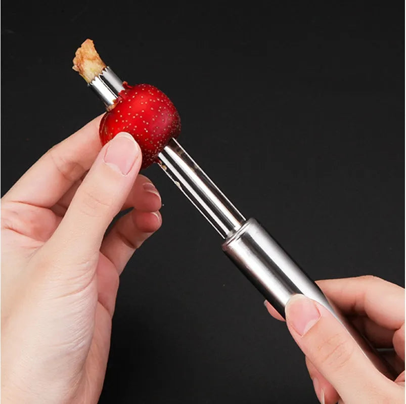 Stainless steel pineapple corer slicer with ABS handle on a kitchen worktop
