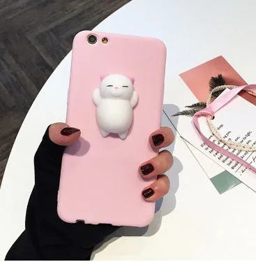 Soft pink silicone iPhone case with a 3D cartoon cat design on the back.